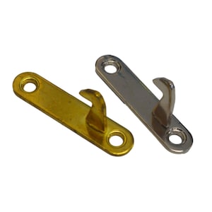 May include: Two metal hooks, one gold and one silver, with a flat base and a hook on one end. The hooks are used for hanging items.