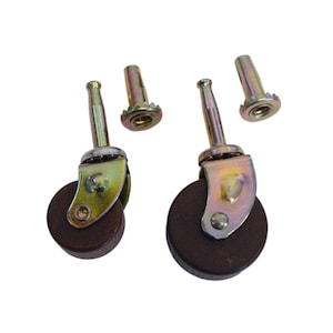 May include: Set of four brown wooden furniture casters with metal stems and metal mounting plates. The casters have a diameter of approximately 1.5 inches.