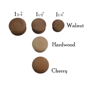 May include: Three wooden knobs in different sizes: 1 3/4", 1 1/2", and 1 1/4". The knobs are in three wood types: walnut, hardwood, and cherry.