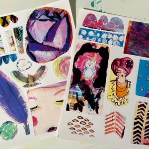 May include: Two sheets of paper with colorful abstract designs and illustrations. The designs include a purple flower, a bird, a feather, a woman's face, a woman with an owl, a woman with a flower in her hair, and various geometric patterns. The text "What would you create?" is written on one of the sheets.