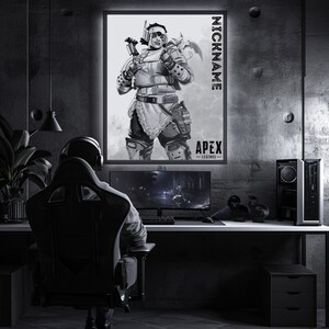 May include: A black and white illustration of a video game character from Apex Legends. The character is a woman with a large hammer and a helmet. The text "NICKNAME" and "APEX LEGENDS" is on the poster.