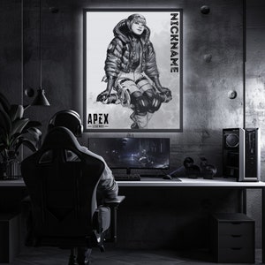 May include: A black and white illustration of a video game character from Apex Legends. The character is wearing a winter jacket and helmet. The image is framed and hanging on a wall in a gaming room.