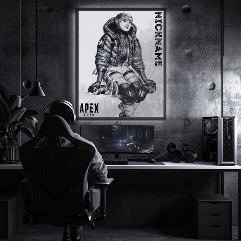 May include: A black and white illustration of a video game character from Apex Legends. The character is wearing a winter jacket and helmet. The image is framed and hanging on a wall in a gaming room.