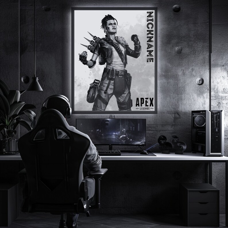 May include: A black and white illustration of a video game character from Apex Legends. The character is a woman with short, spiky hair and is wearing a leather jacket and trousers. The illustration is framed and hanging on a wall.