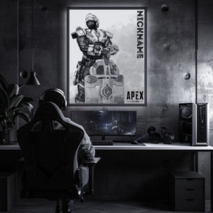 May include: A black and white illustration of a video game character from Apex Legends. The character is holding a large weapon and is wearing a helmet and armour. The image is framed and hanging on a wall in a dark room. The text "NICKNAME" and "APEX LEGENDS" is visible on the image.