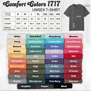 May include: A Comfort Colors 1717 unisex t-shirt color chart featuring a sizing table with width, length, and sleeve measurements in inches. Below the table, forty-eight folded t-shirts are displayed in a grid, each labeled with its specific color name.