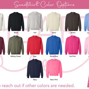 May include: A selection of crewneck sweatshirts in various colors, including white, black, ash, sand, brown, Carolina blue, maroon, military green, red, royal blue, hot pink, light pink, navy, and neon pink. The text "Sweatshirt Color Options" is at the top.