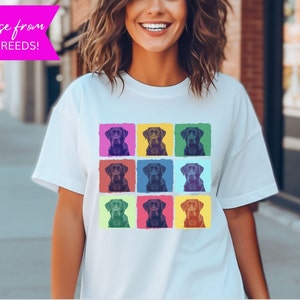May include: A white t-shirt with a pop art design featuring a black labrador retriever in nine different colored squares.