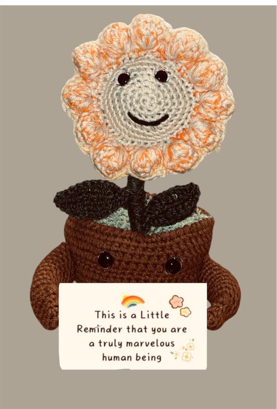 Crochet flower with positive affirmation message