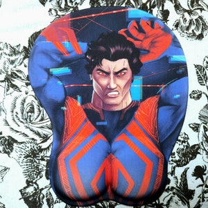 May include: Ergonomic mousepad featuring a muscular male figure in a blue and red superhero-style outfit. The character has an angry expression with red eyes and is set against a dark background with digital lines.