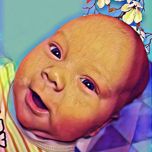 May include: A close-up of a baby's face with a bright, happy expression. The baby is wearing a striped shirt and has a flower crown on their head.