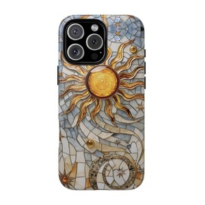 May include: A phone case with a mosaic design featuring a gold sun and stars on a white and blue background.
