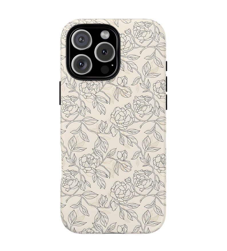 May include: A phone case with a floral design. The case has a cream-colored background with a pattern of black line-drawn flowers and leaves. The camera lenses are visible at the top.