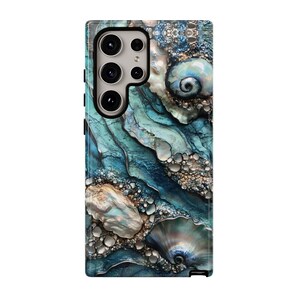 May include: A phone case with a blue, green, and gold abstract design featuring a seashell pattern.