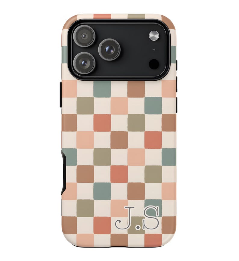 May include: A phone case with a checkerboard pattern in shades of beige, peach, green, and brown. The case has a black camera module and the initials "J.S." are printed in a serif font at the bottom.