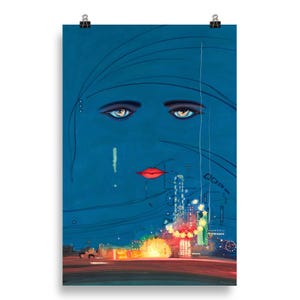 May include: A blue and black art print featuring a stylized woman's face with long eyelashes and red lips. The background is a dark blue with a cityscape in the bottom half of the image.