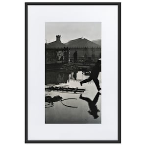Behind the Gare Saint-Lazare photograph by Henri Cartier-Bresson Framed Poster with Mat
