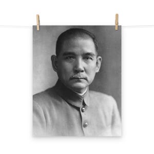 May include: Black and white portrait photograph of a man with a mustache wearing a collared shirt.