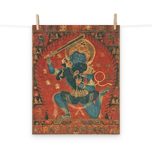 May include: A blue deity with three eyes, holding a sword and a lasso, stands in a fierce pose on a red background. The deity is surrounded by smaller figures and intricate patterns.