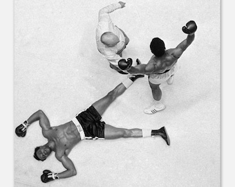 Muhammad Ali standing over Cleveland Williams Matte Poster