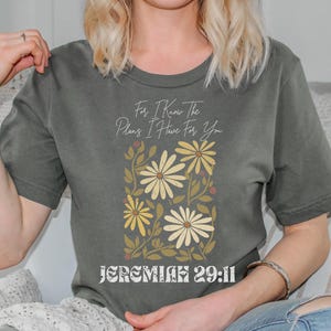 Floral scripture T-shirt with a faith-filled message, designed for Christian women who love stylish, worship-inspired outfits.