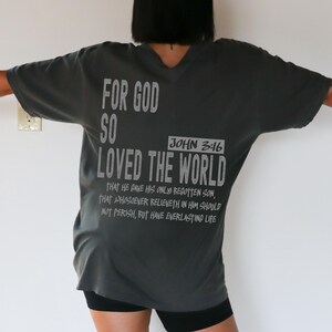 Faith-based graphic tee with an oversized fit, featuring John 3:16 Bible verse, perfect for moms, dads, husbands, or wives as a religious gift.