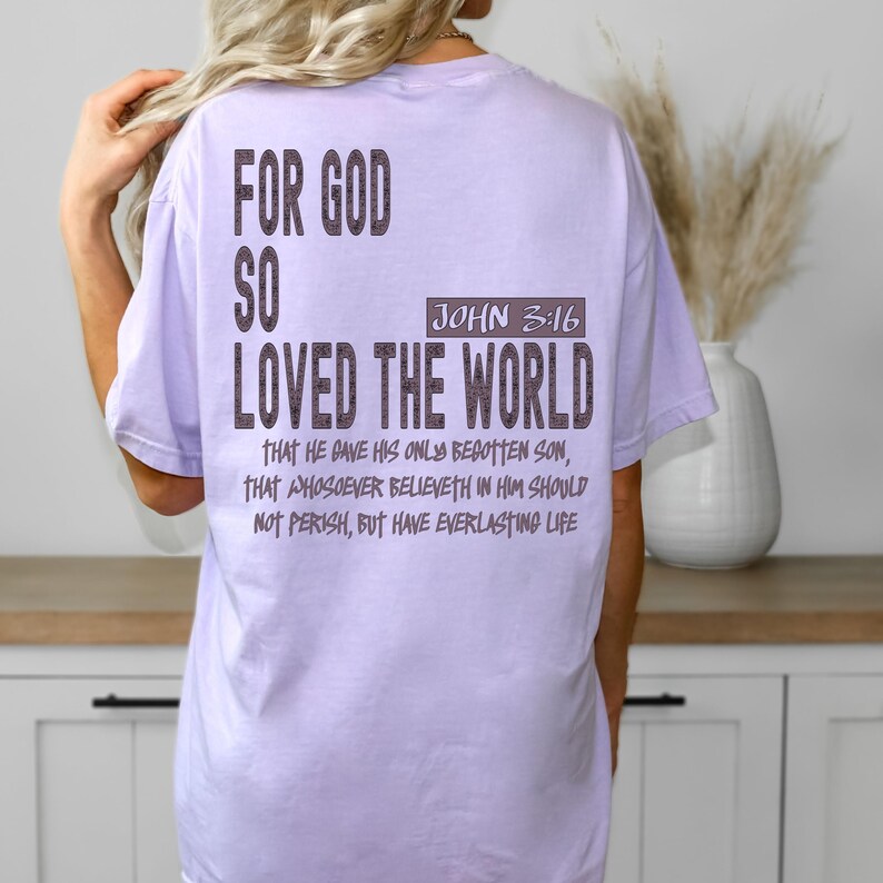 Religious oversized T-shirt with scripture design, showcasing “For God So Loved The World,” suitable as a thoughtful Christian gift for loved ones.