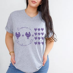 Chicken math humor t-shirt with a quirky design for chicken lovers. Ideal for chicken moms and fans of roosters and peckers, this funny tee makes a great gift for anyone who appreciates chicken humor.
