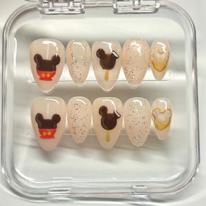 Disneyland treats, glue on fake nails, beignets, Mickey Apple, Mickey ice cream, sparkles