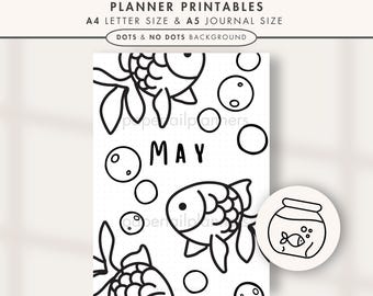 May include: Black and white planner cover page with goldfish illustrations and the word "MAY". The design includes bubbles and a goldfish bowl. Text at the top reads "MAY GOLDFISH COVER PAGE" and "PLANNER PRINTABLES".