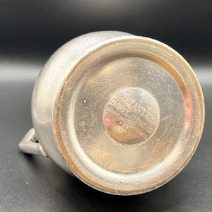 May include: A rustic wooden sign with the text "Welcome to our home" in white lettering. The sign features a distressed finish and a simple, inviting design, perfect for entryway decor.