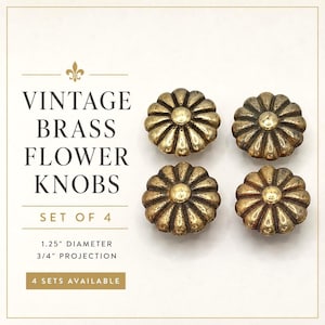 May include: A set of four brass flower knobs with a dark, aged finish. The text reads: VINTAGE BRASS FLOWER KNOBS, SET OF 4, 1.25" DIAMETER, 3/4" PROJECTION, 4 SETS AVAILABLE. Each knob features a circular center with radiating petal-like segments.