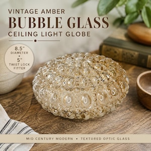 May include: An amber-colored bubble glass ceiling light globe with a textured optic finish. The glass shade features an 8.5-inch diameter and a 5-inch twist lock fitter. The text on the image reads: VINTAGE AMBER BUBBLE GLASS CEILING LIGHT GLOBE.