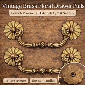 May include: Vintage brass floral drawer pulls with a French Provincial design. Each pull features an ornate rosette and measures 4 inches center to center. Set of 2 dresser handles.