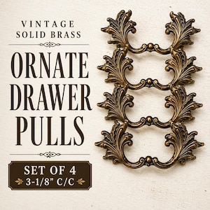 May include: Vintage solid brass ornate drawer pulls. The image shows four decorative pulls with an intricate, floral design. The pulls are a warm, antique gold color. The text on the image reads "Set of 4 3-1/8" C/C".