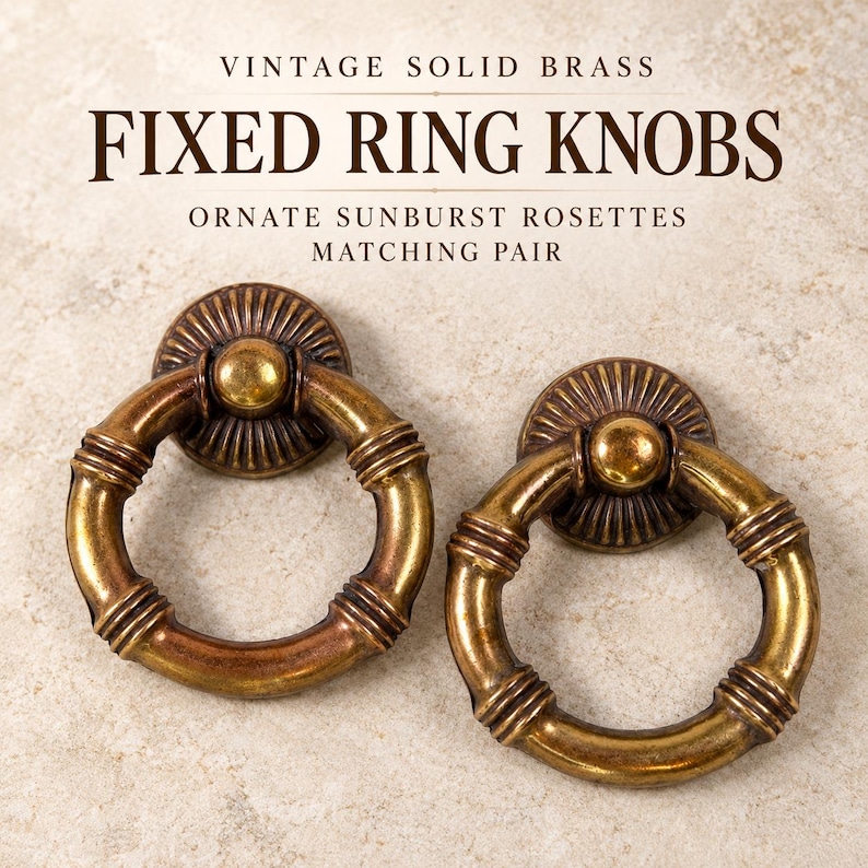 May include: A matching pair of solid brass fixed ring knobs with ornate sunburst rosettes. The text reads: VINTAGE SOLID BRASS FIXED RING KNOBS ORNATE SUNBURST ROSETTES MATCHING PAIR. The circular rings feature a segmented, bamboo-like design.