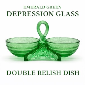 May include: Emerald green Depression glass double relish dish. The dish features two round bowls connected by a handle. The handle has a loop design. The base of the dish has a leaf pattern. The text "Emerald Green Depression Glass Double Relish Dish" is in the image.