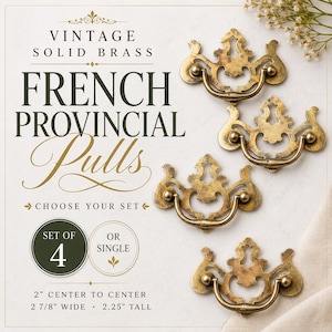 May include: Vintage solid brass French Provincial pulls. The image shows four ornate, antique-style drawer pulls with a curved handle and decorative detailing. Each pull measures 2 inches center to center, 2 7/8 inches wide, and 2.25 inches tall.