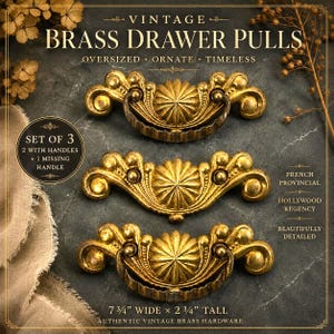 May include: A set of three ornate brass drawer pulls, each measuring 7 3/4 inches wide by 2 3/4 inches tall. Two pulls feature swinging handles, while one is missing its handle. The hardware displays a central sunburst motif with scrollwork.