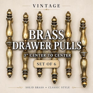 May include: Set of six vintage brass drawer pulls. Each pull has a classic design with a center-to-center measurement of 3 inches. The image includes the text "VINTAGE", "BRASS DRAWER PULLS", "3" CENTER TO CENTER", "SET OF 6", "SOLID BRASS", and "CLASSIC STYLE".