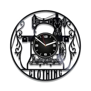 May include: Black vinyl record clock featuring a silhouette of a sewing machine and the words "Manufacturing Clothing".