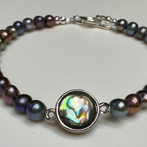 Genuine abalone shell connector in platinum plated brass and “peacock” freshwater pearls bracelet