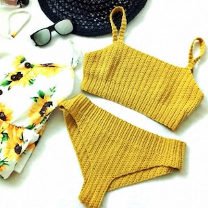 May include: A yellow crochet bikini top and bottom set. The top has thin straps and a square neckline. The bottom has a high-cut leg and a low rise.