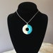 Vintage Womens Circle Pendant with Turquoise and Ivory Enamel set in Silver Tone Metal