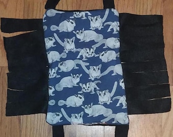 Bridge/ramp/hammock with sugar glider cotton print and anti-pill fleece with fringe for animal enclosures in various sizes and colors.