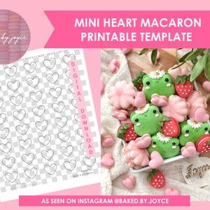 May include: Printable template for making mini heart-shaped macarons. The template is on a white background with a grid pattern. The template is 11 inches by 11 inches. The template is digital and can be downloaded. The image also shows a bowl of macarons decorated with frogs, strawberries, and flowers.