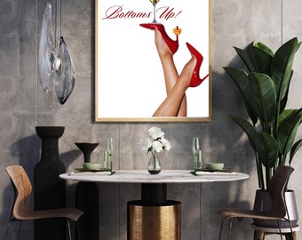 May include: A framed print with a white background featuring a pair of red high heels holding a martini glass. The text "Bottoms Up!" is written in red cursive above the heels.