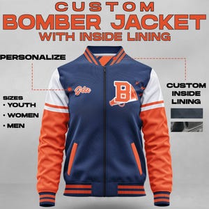 May include: A blue bomber jacket with orange and white sleeves. The jacket has a zipper closure and a ribbed collar, cuffs, and hem. The jacket has a custom inside lining and the text "Gia" and "B" on the front.