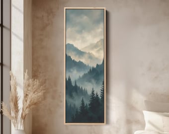 Puede incluir: Una impresión artística vertical enmarcada que representa una escena de montaña brumosa. La obra presenta un bosque de árboles de hoja perenne en tonos verdes y azules, con montañas al fondo. El cielo es una mezcla de tonos claros y oscuros, y el marco es de color madera clara.