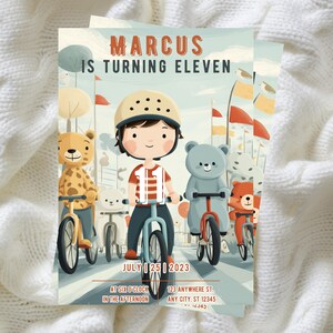 May include: A whimsical birthday invitation featuring a cartoon illustration of a boy on a bicycle, surrounded by animal friends on bikes. The text reads "MARCUS IS TURNING ELEVEN" with the date "JULY 25 2023" and event details.